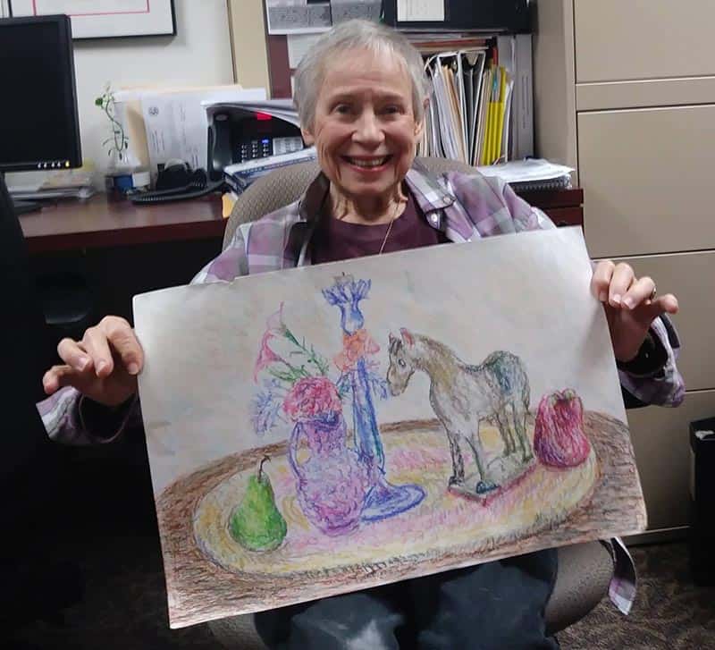 Woman holding artwork