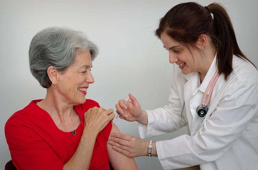 senior citizen getting flu shot